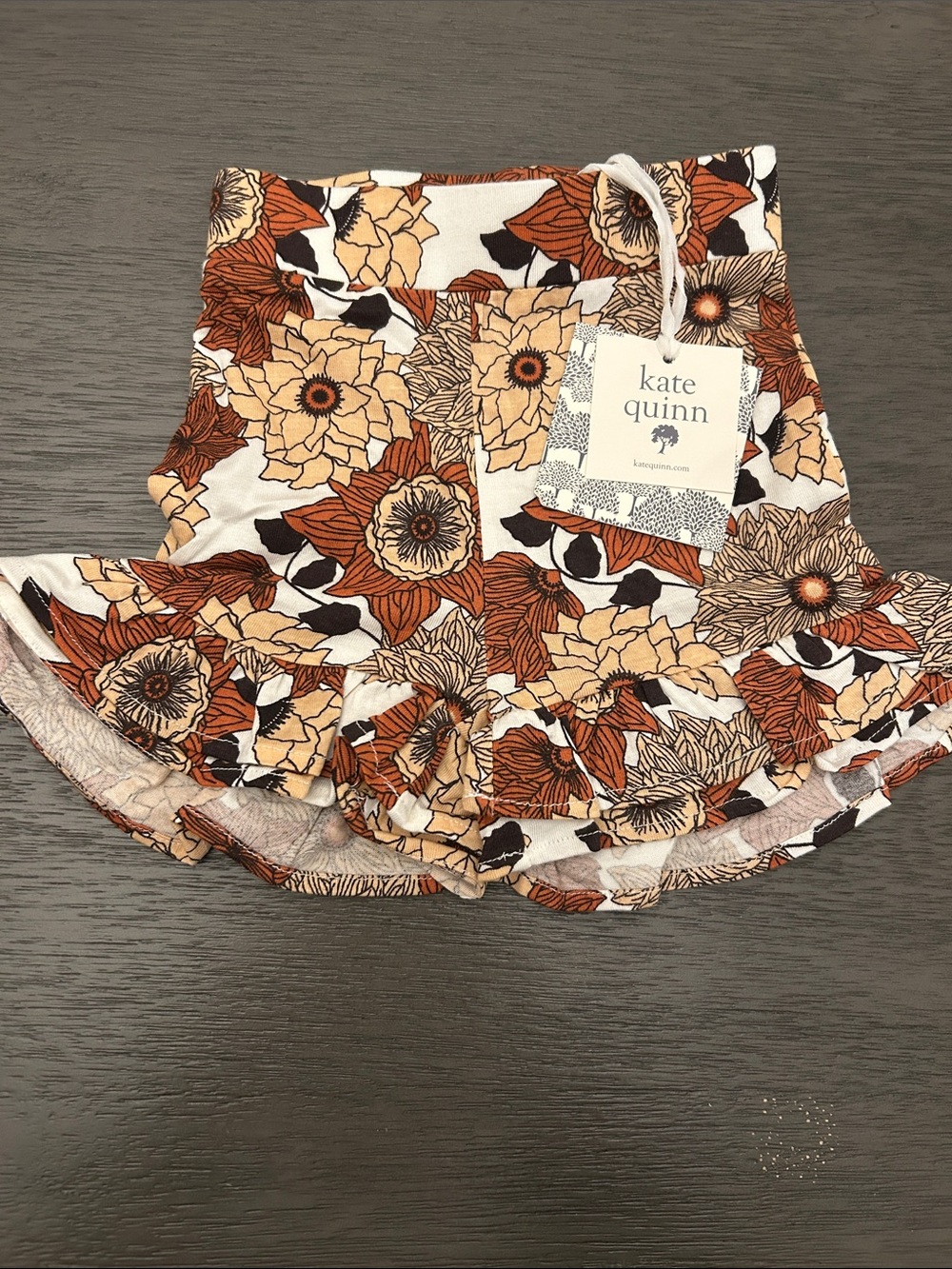 kate quinn Floral Ruffle Shorts in White, Rust, and Beige